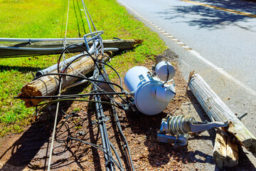Strong winds of hurricane caused electric poles to crash down break their wires during storm