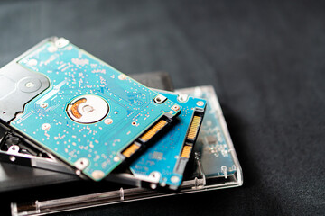 Close-up of Stacked Hard Drives on Dark Surface