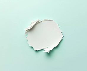 A single white cosmetic swatch centered on an isolated pastel green background, with soft shadows and subtle lighting for textural detail.
