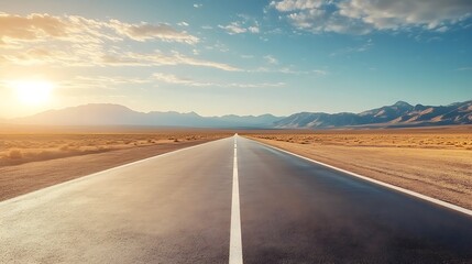 Naklejka premium Empty Road Through Desert Landscape Under Sunset Sky