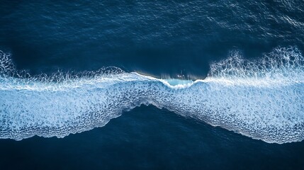 Fototapeta premium Aerial View of a Blue Ocean Wave Crashing