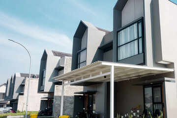 Terraced family homes in newly developed housing estate. Residential homes with modern facade.