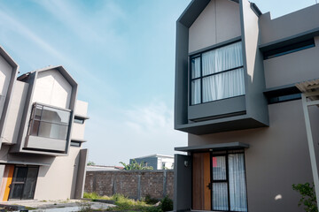 Terraced family homes in newly developed housing estate. Residential homes with modern facade.