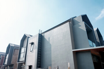 Terraced family homes in newly developed housing estate. Residential homes with modern facade.