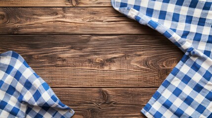 Obraz premium Blue-and-white checkered tablecloth on a wooden background