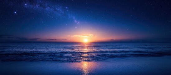Fototapeta premium A beautiful sunset over the ocean with a clear starry sky.