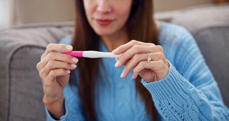 Pregnancy test, results and hands of woman on sofa for fertility treatment, ivf and family...