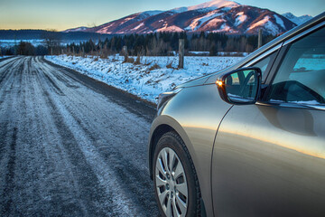 Car on the country road during winter.