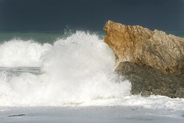 Waves Heavily Crashing on Coastal Rocks - Dramatic Seaside Action