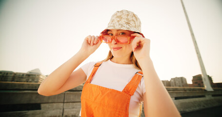 Bridge, woman and portrait with sunglasses for fashion, streetwear and confidence for cool clothes...
