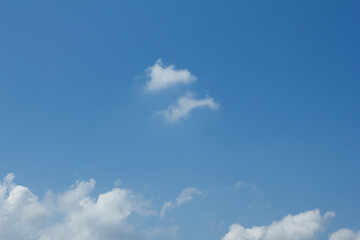 
Blue sky and white puffy clouds