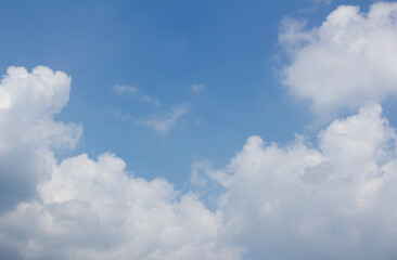 
Blue sky and white puffy clouds