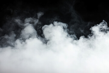 Fototapeta premium Smoke swirling on black background, creating mesmerizing patterns.