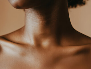close up view of smooth, elegant neck showcasing natural skin tones and contours, highlighting beauty and grace. soft lighting enhances skins texture and warmth
