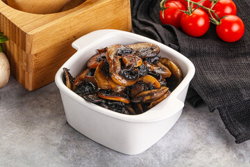 Roasted champignon mushrooms in the bowl