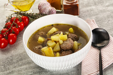 Soup with meatball and potato