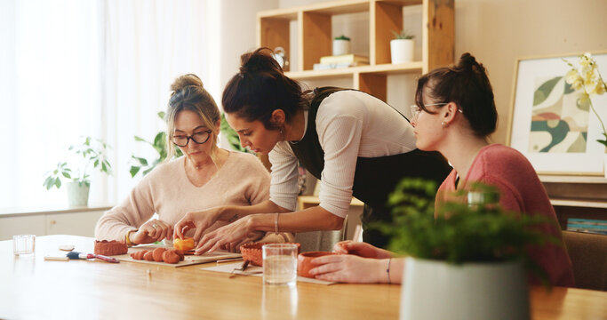 Pottery workshop, teaching and women with clay sculpture for molding skills, lesson and art product. Students, workshop or creative artists learning in small business with hobby and craft project