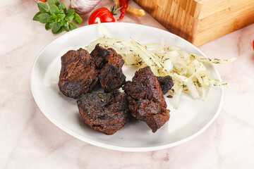 Grilled beef barbecue served onion