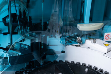 Automated medical analyzer in a laboratory setting, featuring a modern diagnostic device for clinical tests and health assessments.