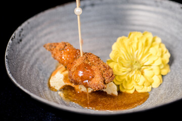 Chicken and waffles dripping with honey