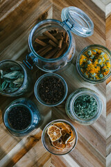 Grouping of mason jars full of herbs