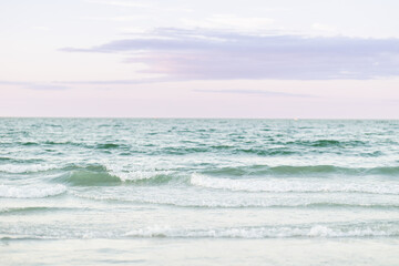 Gentle waves and open sky at Wingaersheek Beach, Gloucester, MA.