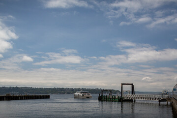 Ferry ship pulling away from pier in Puget Sound Seattle