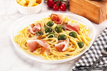 Pasta spaghetti with olives and jamon