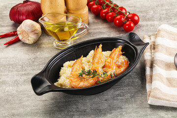 Italian risotto with prawn served thyme