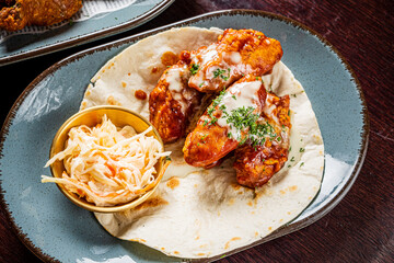 chicken wings with sauce and salad