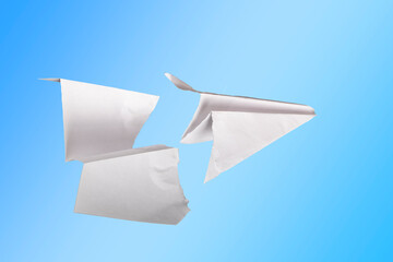 paper plane in the middle it is torn. concept of breakdown, accident, crash, does not work. close-up.