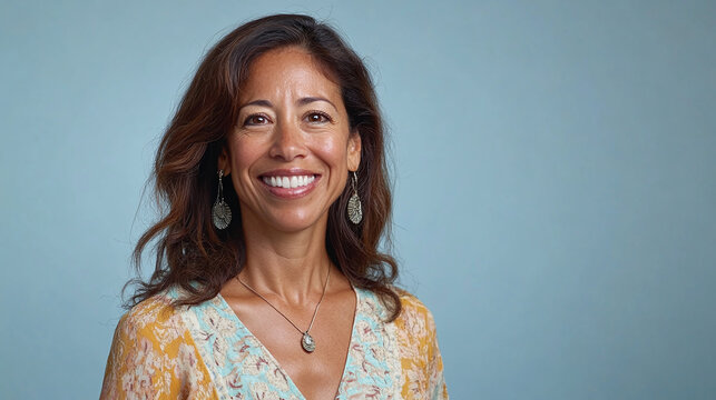 A supportive counselor with a warm smile, against a serene light blue backdrop