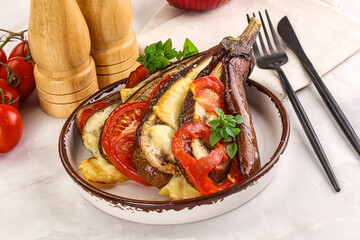 Baked tomato with mozzarella and tomato