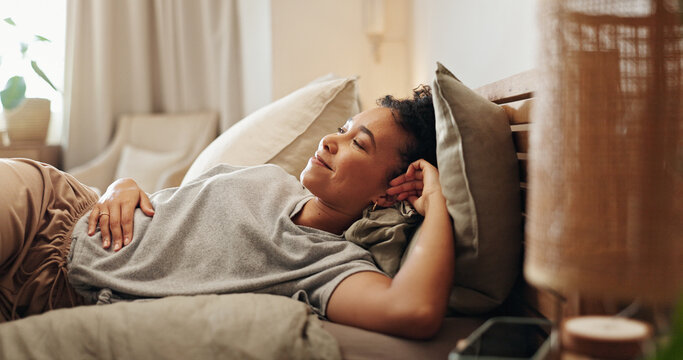 Woman, thinking and relax in bedroom, comfortable and morning peace for reflection in home. Female person, happy and chilling on bed for contemplating, apartment and ponder perspective on weekend