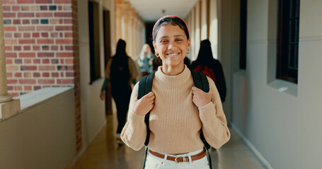 Smile, hallway and portrait of student at school with backpack for learning, studying or knowledge. Happy, teenager and girl from Mexico in corridor of academy for education class with scholarship.