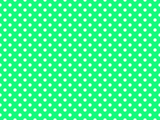 texturised white color polka dots over spring green background