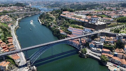Obraz premium Drone view of Luis I Bridge, connecting Porto’s historic center with Vila Nova de Gaia