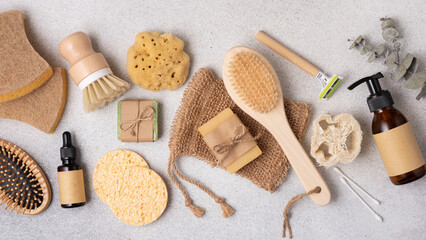 Aesthetic flat lay of eco-friendly skincare and beauty products including bamboo brushes, soap, and glass bottles