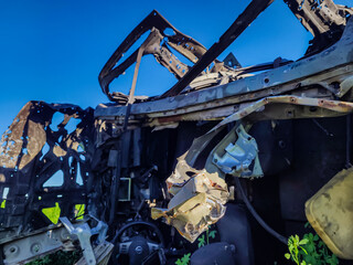 a car blown up and shot by Russian terrorists on Ukrainian territory closeup