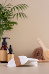 Natural skincare products featuring reusable cotton pads, eco-friendly packaging, and spa essentials