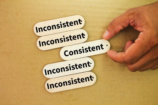 sticks and hands with consistent or inconsistent words. hand pick is consistent. Acting or performing in a reliable and uniform manner over time.