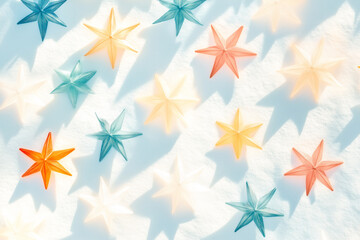 Decorative white Christmas stars with golden accents and fairy lights on white background. Festive holiday decor concept