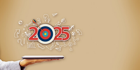 Business concept for 2025 target goal with graphics and background elements illustrating plans and strategies.