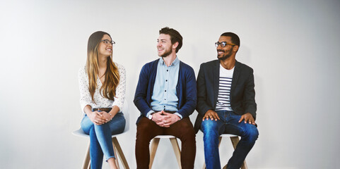 Row, chair and group in waiting room, smile and professional in business, recruitment and talking....