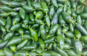 buying vegetables(jalapeno,pepper) at the market