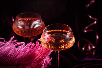 Extravagant glamour background with glass of sparkling wine for love party at muffled light....