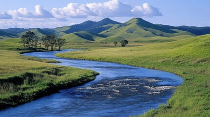 Fototapeta premium A Serpentine River Winding Through Rolling Green Hills