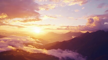 A serene mountain landscape at sunrise with light filtering through the clouds.