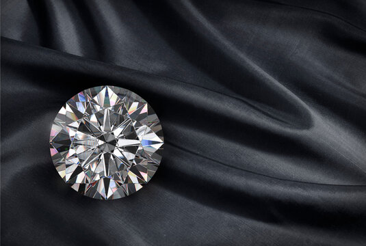 Dazzling diamond on black fabric background