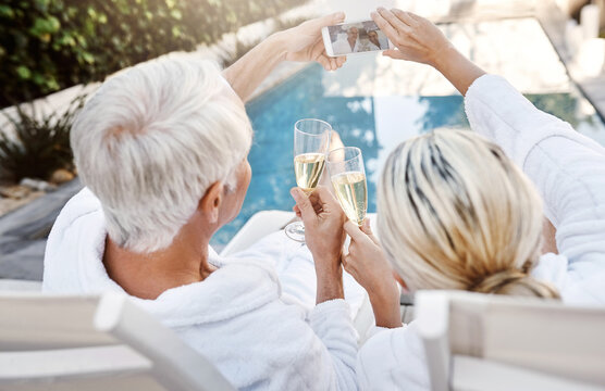 Senior couple, selfie and champagne by pool with toast, care or love at luxury resort on vacation. Mature man, woman and memory by water for celebration, drinks and cheers with wine glass in Greece